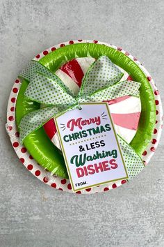 a paper plate with christmas and less washing dishes on it