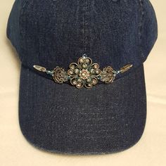 Denim Ball Cap With A Beautiful Western Twist On A Cowgirl's Ball Cap. Embellished With Swarovski Crystals, Feathers And Other Delights. Note: Earrings Are Sold Separately For $25. Or Buy Cap And Earrings For $60.00 Size: One Size Condition: New Note: Due To Almost Loosing My Own Cap To The Wind, A Stampede Strap Can Be Added (A Sample Is Illustrated In The Last Photo). The Stampede Strap Can Be Added, But By Request Only. Spring Adjustable Medium Wash Baseball Cap, Adjustable Denim Visor Hat, Adjustable Spring Baseball Cap, Spring Adjustable Denim Blue Baseball Cap, Adjustable Medium Wash Snapback Hat, Cabby Hats, Embellished Hats, Cabby Hat, Hat Patterns To Sew