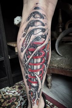 a man's leg with a tattoo on it that has an image of a medical device