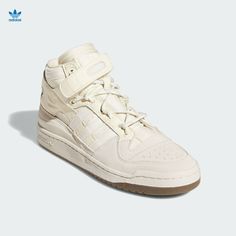 Ivy Park x Adidas Forum Mid 'Icy Park / Cream White' GW2857 Unisex Size 8.5 New! Part of the Icy Park collection, the Ivy Park x Forum Mid 'Icy Park - Cream White' released in collaboration with Beyoncé's streetwear brand. The shoe's vintage basketball construction emerges in a mix of leather and suede, finished in various white and off-white hues and supported by an adjustable strap around the collar. A padded inner lining includes terry cloth for comfort, while underfoot, the rubber midsole in Adidas Superstar All White, White Sneaker Boots, Adidas Forum Mid, Adidas Shoes Originals, Mid Sneakers, Vintage Basketball, Adidas Forum, Cream Shoes, Ivy Park