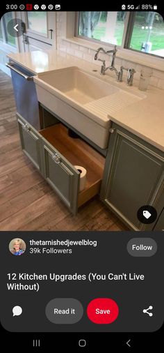 a kitchen sink with an open drawer in it