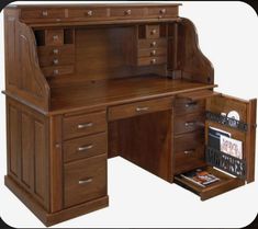 a wooden desk with drawers and a book shelf in the bottom drawer that is open