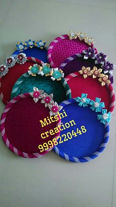 several different colored hats with bows and ribbons on the bottom one has a name tag that says miss creation 9992308