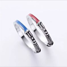 two rings with different colors and designs on each ring, one is red white and blue