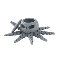 a toy that is shaped like a spider with eyes and claws on it's head