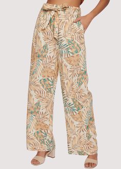 Experience elevated comfort and tropical style with the Anafi Palm Pants. Crafted from a lightweight linen fabric, these pants offer a high-rise silhouette and wide legs for cool, breezy wear. The pockets and tie belt add convenience, perfect for summer days spent out and about. Add your favorite tee or sport your swim top as you wander around the beaches this season! WPWC34128 Imported 55% Linen, 45% Rayon Model is 5 ft 9 inches; Bust: 32", Waist: 23.5", Hips: 35" and wearing a size Small Runs High Waist Wide Leg Pants With Pockets For Vacation, Vacation Wide Leg Pants With Pockets, Tropical Style Cotton Vacation Bottoms, Tropical Cotton Bottoms For Vacation, Tropical Cotton Vacation Bottoms, High Waist Cotton Wide Leg Vacation Pants, High-waist Cotton Wide Leg Pants For Vacation, High Waist Cotton Wide Leg Pants For Vacation, High Waist Wide Leg Cotton Pants For Vacation