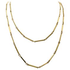 Beautifully 1980s 18 karat yellow gold long chain necklace. Measuring 39.5 inches in length it can be casually worn at full length or doubled up as a choker. Elongated rectangular bar links are flexibly connected to oval rings letting the bars turn and catch the light giving this necklace a charming lively effect. Luxury Long Drop Necklaces With Adjustable Chain, Luxury Double Strand Classic Chain Necklace, Luxury Yellow Gold Bar Necklace Fine Jewelry, Luxury Yellow Gold Chain Necklace With Rectangular Links, Luxury Minimalist Necklace With Rectangular Links, Luxury Everyday Necklace With Rectangular Links, Luxury Yellow Gold Bar Necklace With Adjustable Chain, Gold Long Chain, Long Chain Necklace