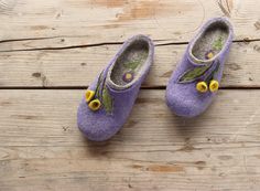 'Violet meadow' Product description: Our felt slippers are totally handcrafted of 100% pure wool with warm water, soap, love and care. The sole, made of craft foam, is firmly glued. Felted slippers are extremely solf, light, comfortable and long-wearing. It will serve you trully for long years. Each pair of slippers is whole-felted and is handmade. None of the manifacturing techniques are being used. Thus your slippers will be unique even if there's a certain likeness with the others from the mo Handmade Comfortable Felt Slippers, Comfortable Handmade Felt Slippers, Comfortable Felt Clogs With Closed Toe, Comfortable Closed Toe Felt Clogs, Felt Slip-on Slippers With Soft Sole, Felt Clogs With Rubber Sole And Round Toe, Comfortable Felt Clogs With Round Toe, Felt Slip-on Clogs With Rubber Sole, Felt Clogs With Rubber Sole Slip-on