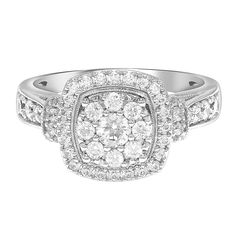 a white gold diamond ring with two rows of diamonds on the band and an oval shaped center