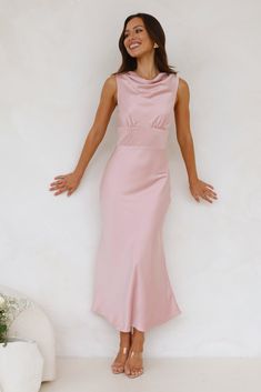 Length from shoulder to hem of size S: 134cm. Chest 41cm, Waist 35cm, across front only of size S. Maxi dress. Lined. Model is a standard XS and is wearing XS. True to size. Non-stretch. Satin. High cowl neck. Button closure to back of neck. Gathered details to top. Zipper with hook eye closure. Cold hand wash only. Polyester/Spandex. For a sleek, sophisticated look, choose the Together As One Satin Maxi Dress. Featuring a silky satin, a high cowl neckline and gathered details to the top. Style with heels for classy attire. Classy Attire, Satin Cowl Neck Dress, Cowl Neck Dress, Halter Maxi, Satin Maxi, Cowl Neckline, Satin Maxi Dress, Halter Maxi Dresses, Pink Maxi Dress