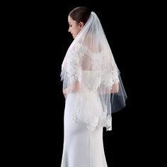 a woman in a wedding dress and veil