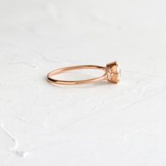 Oval Lady's Slipper Ring | Engagement Ring from Melanie Casey Luxury Oval Cluster Ring In Rose Gold, Delicate Oval Ring With Halo Setting, Delicate Oval Ring With Rose Cut Diamonds, Delicate Oval Solitaire Ring, Fine Jewelry Oval Flower Ring With Halo Setting, Oval Flower Ring With Halo Setting, Luxury Oval Gemstone Flower Ring, Oval Flower Ring With Rose Cut Diamonds, Oval Rose Cut Diamond Flower Ring