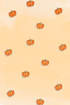 an orange background with pumpkins on it