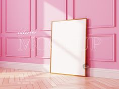 there is a pink room with an empty frame on the floor in front of it