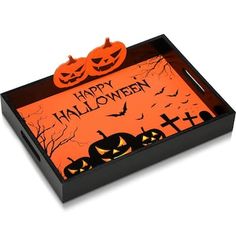 a halloween themed tray with pumpkins and jack - o'- lanterns on it