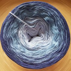 a skein of yarn with a needle in it