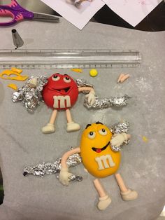 the cake is made to look like m & m characters