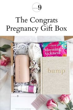 the congrats pregnant gift box is packed with pink flowers and personal care products