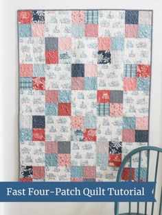 a blue chair sitting in front of a quilt on the wall with words fast four patch quilt