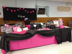 the table is covered with pink and black items