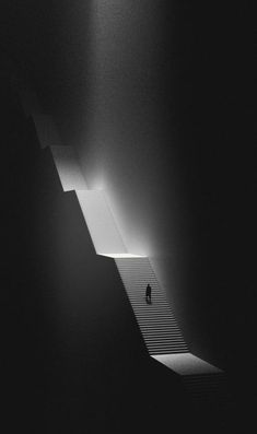 a person walking up some stairs in the dark with light coming from behind them and shadows on the floor