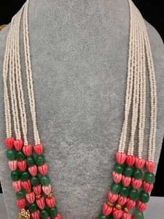 Coral Emerald Nakshi Multi Layer Necklace Only Neckalce no earringsColor : GoldenSize : Necklace Length : 22 Inches Approx;Stones : Pearl Real Emeralds Tulip Beads and Nakshi Balls Traditional White Jewelry With Gemstone Beads, White Beaded Temple Jewelry Mala, Multicolor Gemstone Bead Necklaces For Festive Occasions, White Necklace With Faceted Beads For Festive Occasions, Festive Multicolor Beaded Necklaces With Dangling Beads, Festive Multicolor Beaded Necklace With Dangling Beads, Festive White Jewelry With Colorful Beads, Handmade White Kundan Necklace With Round Beads, Traditional Pink Jewelry With Polished Beads