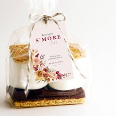 two cookies in a bag with a tag on it that says, take some s'more