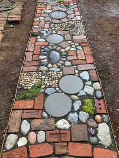 a walkway made out of bricks and stones