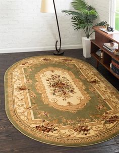 a large rug in the middle of a living room with a lamp on top of it