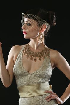 Gold masquerade veil, in a Venetian, bandeau, mask style. Hand made, with a small hand stitched loop each side, for you to slide a bobby pin through. Very easy and light to wear.  Measurements. 5 inches height. 16 inches width. Great for Brides, photo shoots, dramatic 1920's, gothic, Halloween or glamour! Elegant Adjustable Masquerade Mask For Wedding, Elegant Wedding Masquerade Mask Adjustable, Elegant Adjustable Wedding Masquerade Mask, Traditional Headband For Party, Elegant Gold Masquerade Mask For Wedding, Elegant Adjustable Veil For Party, Traditional Headband Fascinator For Party, Traditional Adjustable Fascinator For Parties, Elegant Wedding Headpiece