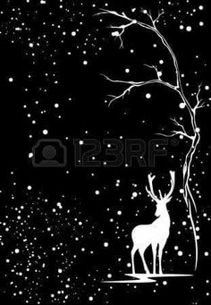 a black and white image of a deer under a tree with snow falling on it