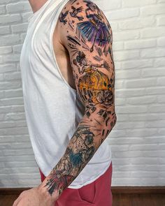 a man with many tattoos on his arm