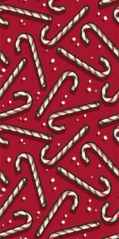 candy canes on a red background with white and black dots in the center,