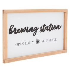 a sign that reads brewing station open daily self serve