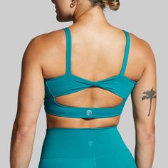 With an extended body, flattering twisted back design, and added coverage around the chest, this sports bra will truly be "Your Go To.” From sweaty Pilates sessions to hitting new PR’s in the weightroom, this bra provides maximum support without digging into your lats or shoulders resulting in superior comfort and performance. Green Sports Bra With Built-in Padding For Pilates, Green Sports Bra With Light Support And 4-way Stretch, Sporty Cross Back Sports Bra With Removable Pads, Green Activewear With Medium Bust Support For Yoga, Workout Sports Bra With Removable Pads And Cross Back, Sports Activewear With Removable Bra Pads And Cross Back, Workout Activewear With Removable Bra Pads And Cross Back, Green Sports Bra With Medium Bust Support For Yoga, Sculpting Sports Bra With Removable Pads For Workout