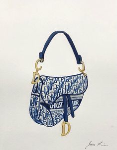 a blue and white purse with gold hardwares on the handles is hanging from a wall