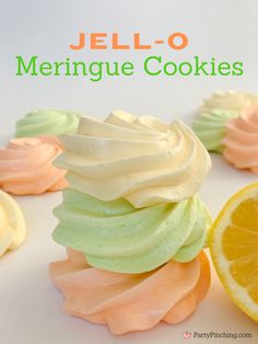 jell - o meringue cookies on a white plate with an orange slice