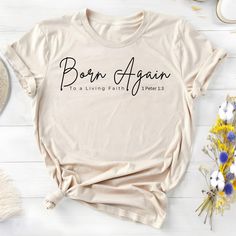 This T-Shirt features a powerful message 'Born Again By Faith' that exudes positivity and faith. It is a perfect addition to the wardrobe of someone looking to express their beliefs and spirituality. Ideal for those who celebrate religious holidays and occasions. Product features - Bella Canva 3001 - 100% Airlume combed and ring-spun cotton for a lightweight and breathable fabric - Retail fit suitable for casual and semi-formal settings - Shoulder tape for added stability and structure - Ribbed knit collar with seam for elasticity and shape retention - DTF inner neck labels for a comfortable wear experience Care instructions - Machine wash: cold (max 30C or 90F) - Non-chlorine: bleach as needed - Tumble dry: low heat - Iron, steam or dry: medium heat - Do not dryclean Meaningful Text Print Crew Neck T-shirt, Meaningful Quote Print Crew Neck T-shirt, Meaningful Text Print Crew Neck Tops, Inspirational Crew Neck Top With Quote Print, Inspirational Crew Neck T-shirt With Lettering, Inspirational Slogan Crew Neck Shirt, Meaningful Relaxed Fit T-shirt With Letter Print, Inspirational Lettering Crew Neck T-shirt, Inspirational Quote Print Crew Neck Top