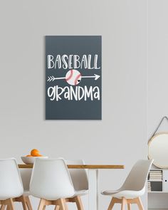 there is a baseball and an orange on the table in this room that says baseball grandma