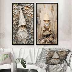 two pictures of gnomes on the wall in a living room with white couches