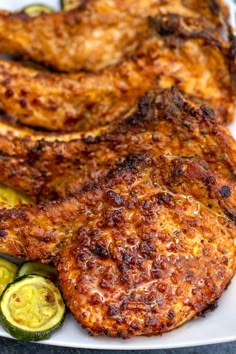 some fried food on a white plate with zucchini