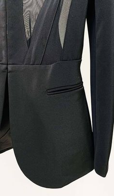 Modern styling defines this black pantsuit featuring an asymmetrical panels and off-center zipper on the tailored jacket. Sleek slim pants balance the bold jacket. A contemporary take on the traditional suit, perfect for the stylish boss. Gentle Dry Clean Only Colour may vary due to lighting on images. The product images (without model) are closest to the true colour of the product.Item runs true to size chart and is cut to suit our size chart. Please refer to our size chart for the best fit. Do Tailored Asymmetrical Blazer For Parties, Fitted Asymmetrical Blazer For Evening, Chic Black Asymmetrical Blazer, Asymmetrical Fitted Evening Blazer, Asymmetrical Fitted Blazer For Parties, Fitted Asymmetrical Blazer For Parties, Asymmetrical Fitted Party Blazer, Fitted Asymmetrical Party Blazer, Structured Black Blazer For Party