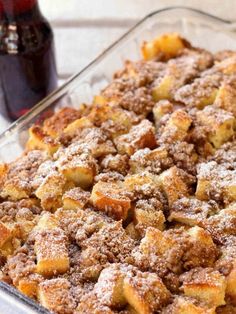 a casserole dish with cinnamon bread and sugar on the top is ready to be eaten