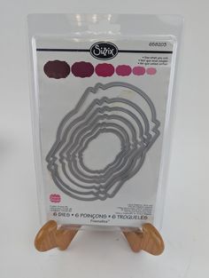 a package of cookie cutters with wooden handles