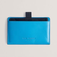 Ted Baker CODY Colour Block Bright Blue Leather Card Holder
Store your cards in one convenient yet secure place with this vibrant and ultra-stylish and compact RFID blocking card holder from Ted Baker. Slim enough to slip into any pocket, it is the ultimate accessory to keep you organised on the go!
Made from genuine bovine leather in a bright blue hue, the card holder has a tab at the top that you can pull up to reveal a sliding central compartment featuring 3 card slots. The interior is lined with a silky black chequered material and the Ted Baker logo is subtly embossed on the front for an extra touch of sophistication.
The cardholder contains an RFID blocker to ensure all your card details and personal information is kept safe.
Brilliantly presented in a Ted Baker branded giftbox, it m Baker Logo, I Love You Mum, Love You Mum, Wax Melt Warmer, Oil Warmer, Bottle Jewelry, Leather Card Holder, Baby Christening, Message In A Bottle