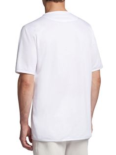 White short-sleeve crew neck t-shirt in cotton jersey with a lustrous look and soft handle. A fine wear-anywhere piece in contemporary wardrobes, this t-shirt has been crafted by staying true to traditions and seeking excellence in every aspect. Themeticulous attention to finishes and details is its calling card. Suitable for any occasion, this Kiton t-shirt can be worn as part of a casual look, or styled under a jacket for a sporty-chic ensemble. We recommend hand washing the garment inside-out. Do not bleach; do not tumble dry. Iron inside-out at a low temperature. Relaxed Fit Pima Cotton T-shirt With Short Sleeves, Relaxed Fit Pima Cotton T-shirt, Contemporary Wardrobe, Expensive Handbags, Calling Card, John Lobb, Sporty Chic, White Short, Hand Washing