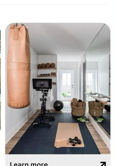 a home gym with exercise equipment and yoga mats on the floor in front of a mirror