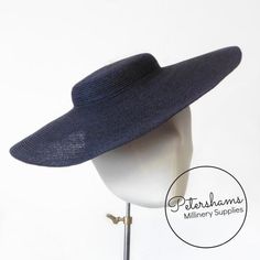 If sustainability and style are your thing, then look no further! These navy blue cartwheel hat bases are made from natural hemp braid sewn into the classic shape that has sprung into popularity in the past year.Ready to trim, they are fitted with a petersham ribbon on the inside crown edge. Simply add a comb or headband to secure to the head and your done!Hat base measures:Measures:Width: 35cm (13.7 inches)Crown height: 2.5cm (1 inch)For even more millinery supplies you can find us here:www.ets Cartwheel Hat, How To Make Fascinators, Blank Hats, Black Fascinator, Millinery Supplies, Women Hats Fashion, Hat Base, Fascinator Hat, Millinery Hats