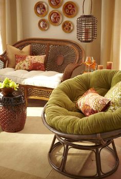 a living room filled with lots of furniture and decor on top of carpeted flooring