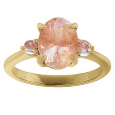 This beautiful ring's ethereal glow of moonstone and shimmering light peach Oregon Sunstone embodies a peaceful reflection, sure to uplift the heart of its beholder. Details: Material: 14K Gold band and prong setting Center Gemstone: 8.5 x 6.5 mm Oregon Sunstone, oval Accent Gemstones: 2.40 mm Moonstone, round Dimensions: 2.5 mm Approx. Shank Base Width, 5.73 mm Approx. Top Height Your Order Includes: Vintage Style Velvet Ring Box Cleaning and Polishing Cloth Ethical Sourcing Recycled Precious MetalsMade in USA Peach Moonstone Ring, Oregon Sunstone, Velvet Ring, Shimmer Lights, Yellow Jewelry, Velvet Ring Box, Knot Earrings, Peach Moonstone, Light Peach